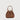 Brown pebbled leather mini bucket bag with gold-tone hardware and top handle by Braun Büffel