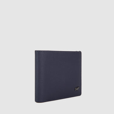 Angled side view of deep blue Braun Büffel men’s leather wallet showcasing slim profile and stitched edges