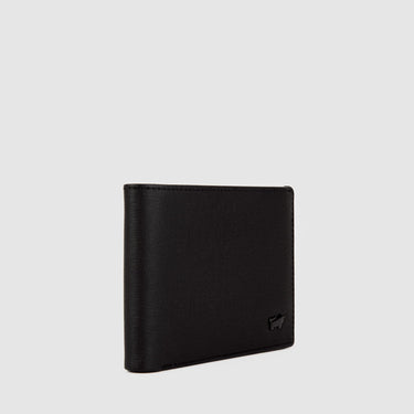 Angled view of a black Braun Büffel men’s wallet highlighting slim profile and clean leather edges