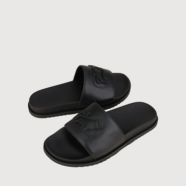 Braun Buffel black leather slide sandals displayed as a pair