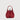 Front view of red pebbled leather mini bucket bag with drawstring closure and top handle by Braun Büffel