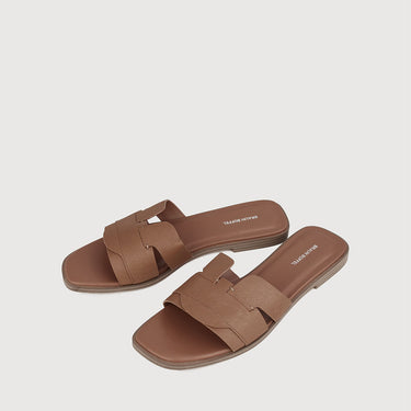 Pair of brown leather sandals with crossover straps by Braun Buffel