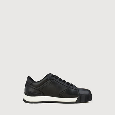 Side view of Braun Buffel black leather sneakers